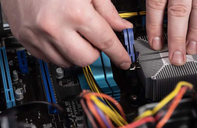 a man assembling electronics as a part of box build assembly process